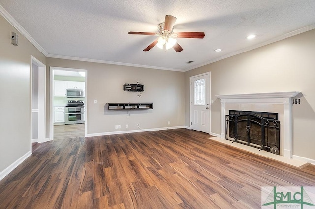 unfurnished living room with crown molding, dark hardwood / wood-style flooring, ceiling fan, and a textured ceiling