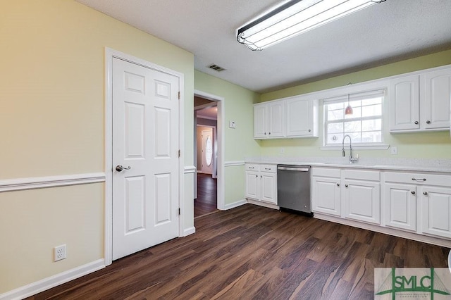 kitchen with white cabinetry, dishwasher, dark wood-type flooring, and sink