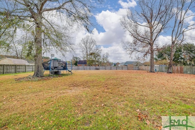 view of yard with a trampoline