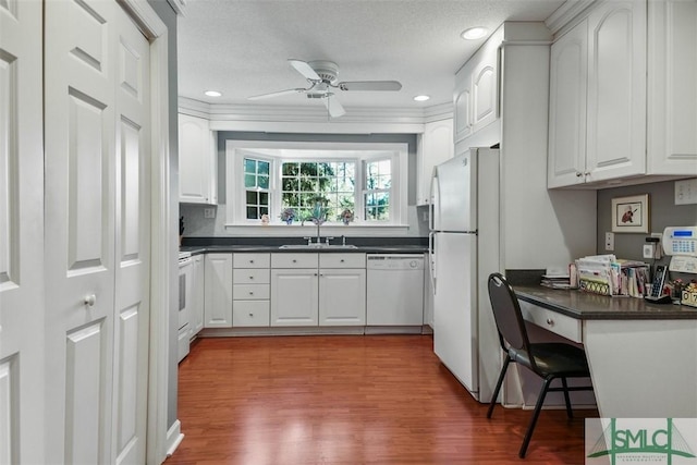 kitchen featuring white appliances, ceiling fan, white cabinetry, and sink