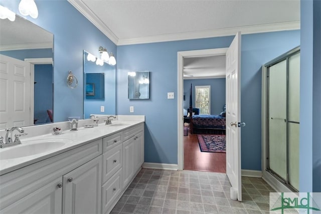 bathroom with walk in shower, vanity, ornamental molding, ceiling fan, and a textured ceiling