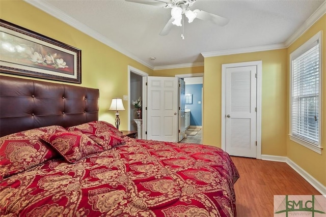 bedroom with ceiling fan, crown molding, and light hardwood / wood-style flooring