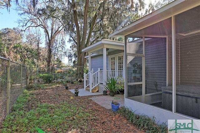 view of yard with a sunroom