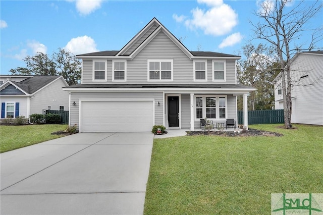 view of property featuring a garage, a front lawn, and covered porch