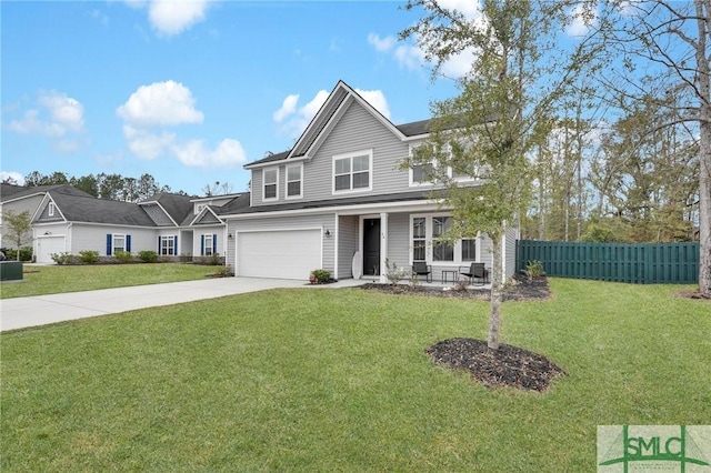 view of front property featuring a garage and a front yard