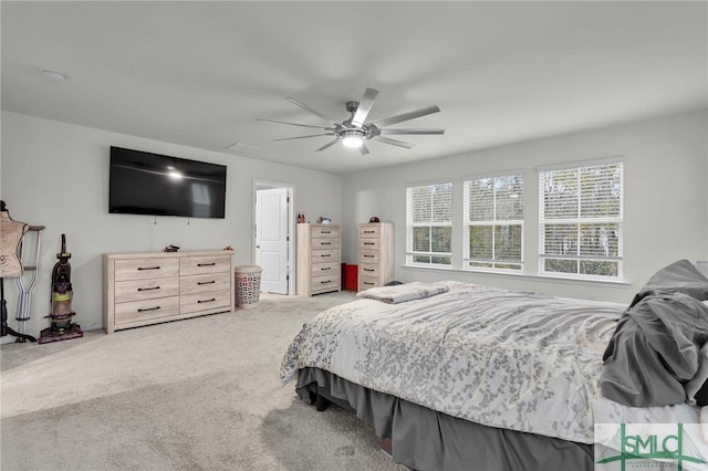 carpeted bedroom with ceiling fan