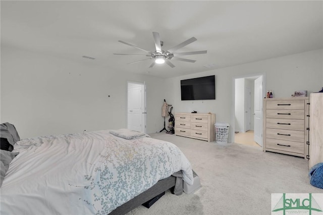 bedroom featuring ceiling fan and light carpet