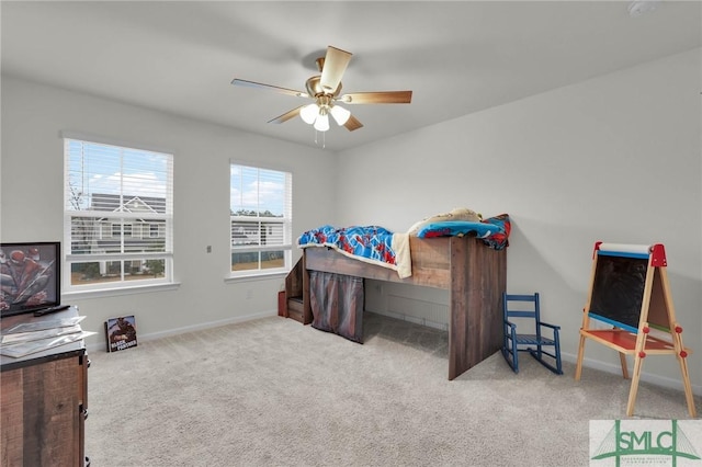 carpeted bedroom with ceiling fan