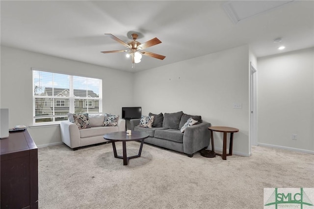 living room featuring ceiling fan and light carpet