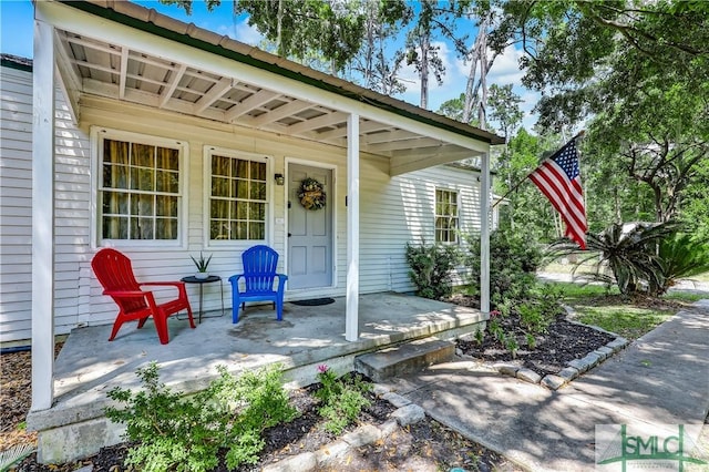 property entrance featuring covered porch