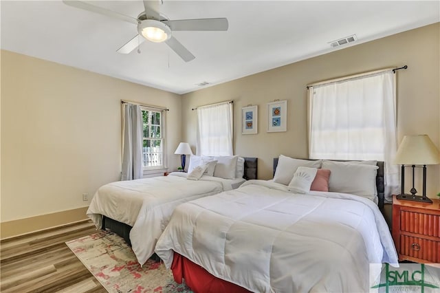 bedroom featuring ceiling fan and light hardwood / wood-style flooring