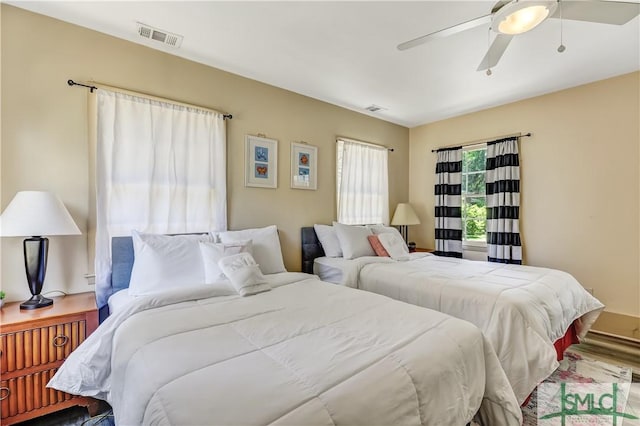 bedroom featuring ceiling fan and hardwood / wood-style floors