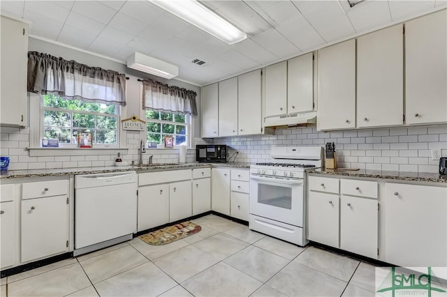 kitchen featuring white cabinets, white appliances, backsplash, and sink