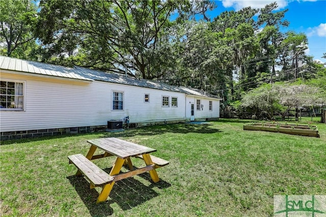 view of yard featuring central AC