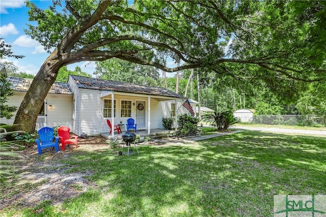 exterior space featuring a front lawn and a porch