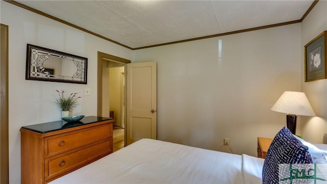 bedroom with crown molding