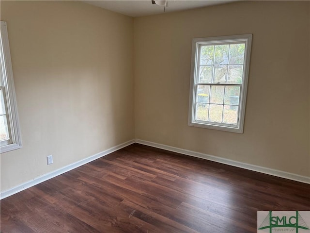 spare room featuring dark hardwood / wood-style flooring