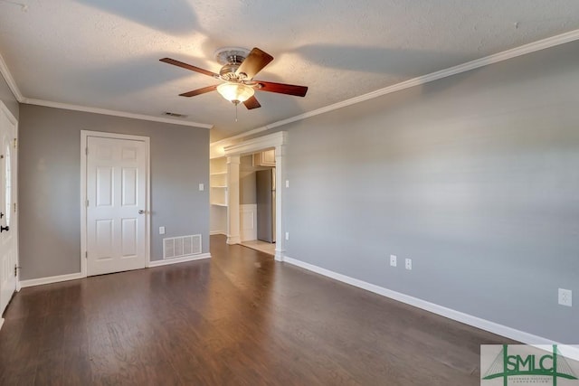 empty room featuring a textured ceiling, ceiling fan, and ornamental molding