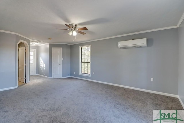 spare room with carpet, an AC wall unit, and ornamental molding