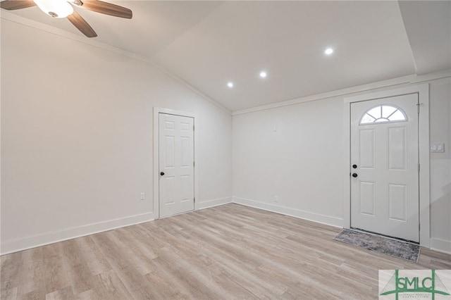 entryway with ceiling fan, light hardwood / wood-style flooring, vaulted ceiling, and ornamental molding