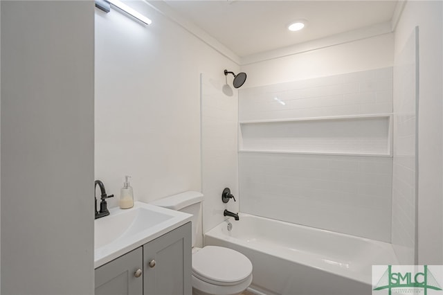 full bathroom featuring bathing tub / shower combination, crown molding, vanity, and toilet