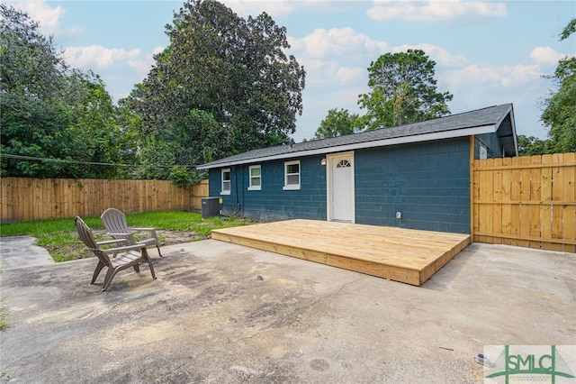 exterior space with a deck, central AC unit, and a patio area