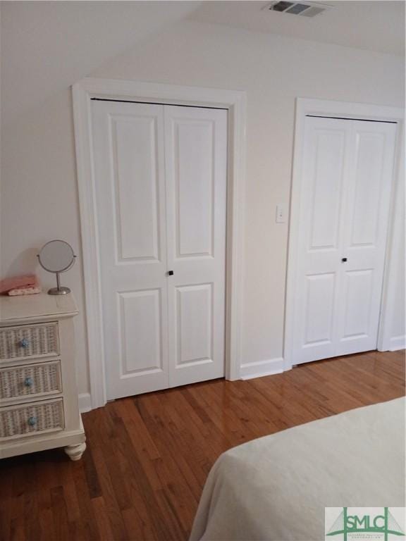 bedroom featuring dark hardwood / wood-style flooring