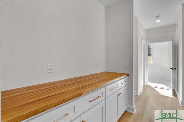 corridor featuring light hardwood / wood-style floors