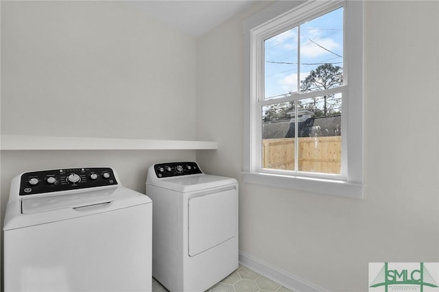 clothes washing area featuring washing machine and dryer