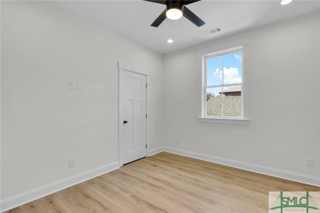 empty room featuring light hardwood / wood-style floors and ceiling fan