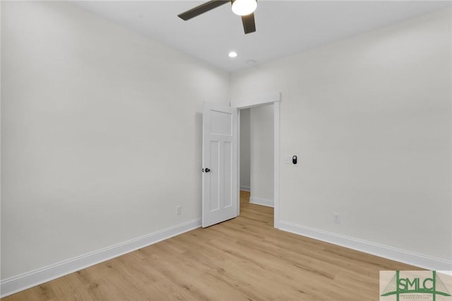 spare room with ceiling fan and light hardwood / wood-style flooring