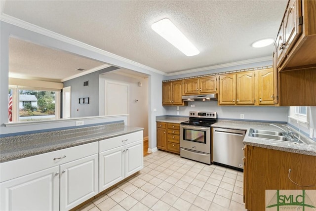 kitchen with crown molding, sink, a textured ceiling, and appliances with stainless steel finishes