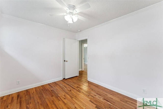 unfurnished room with a textured ceiling, light hardwood / wood-style flooring, ceiling fan, and crown molding