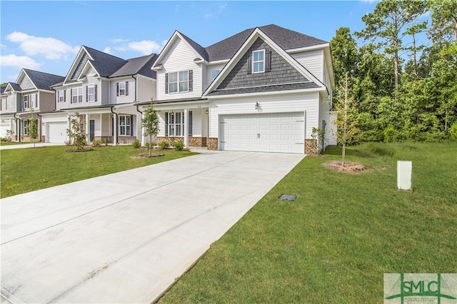 view of front of house featuring a front yard and a garage