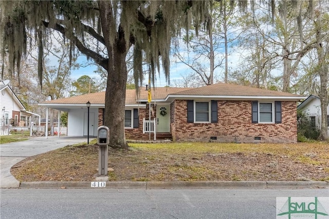 single story home featuring a carport