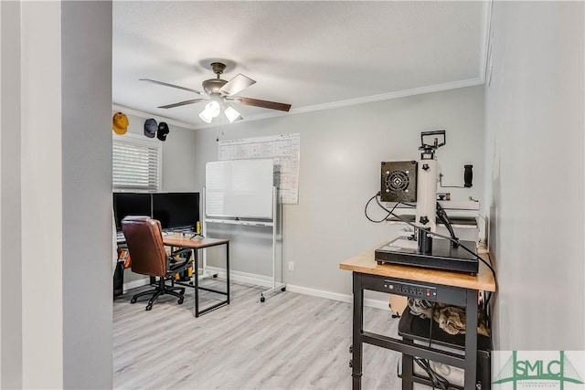 office space featuring ceiling fan, light hardwood / wood-style floors, and ornamental molding