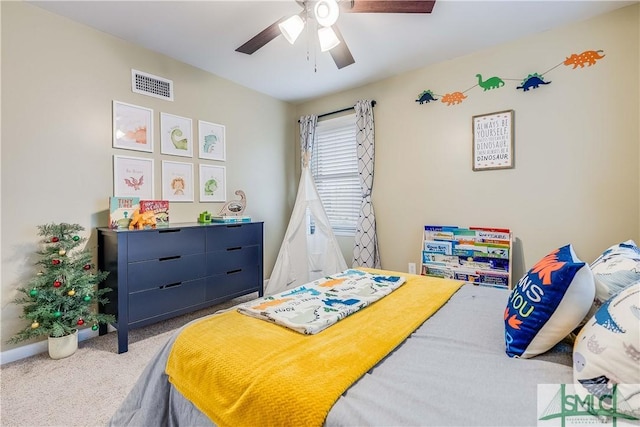 carpeted bedroom with ceiling fan