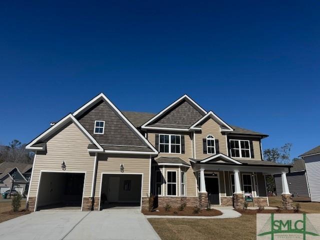 craftsman-style house with a porch and a garage