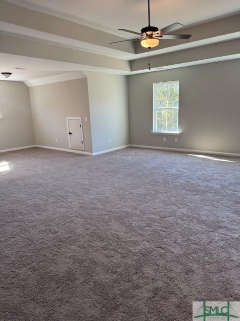 spare room featuring carpet flooring and ceiling fan