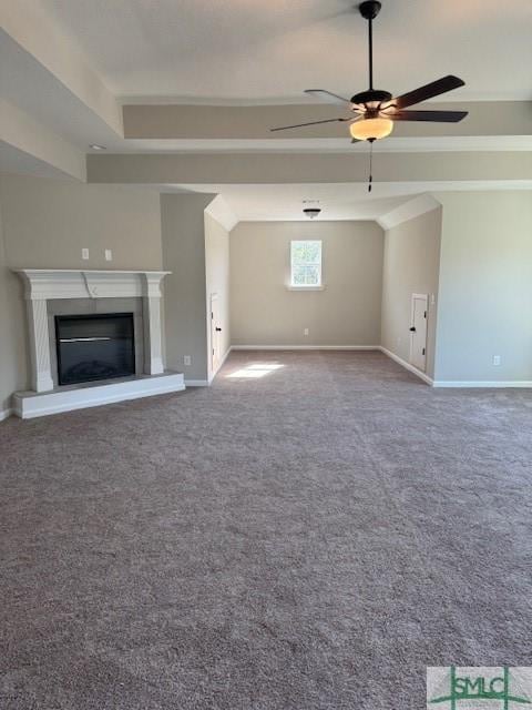 unfurnished living room with carpet flooring and ceiling fan