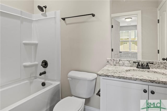 bathroom with shower / tub combination, toilet, and vanity