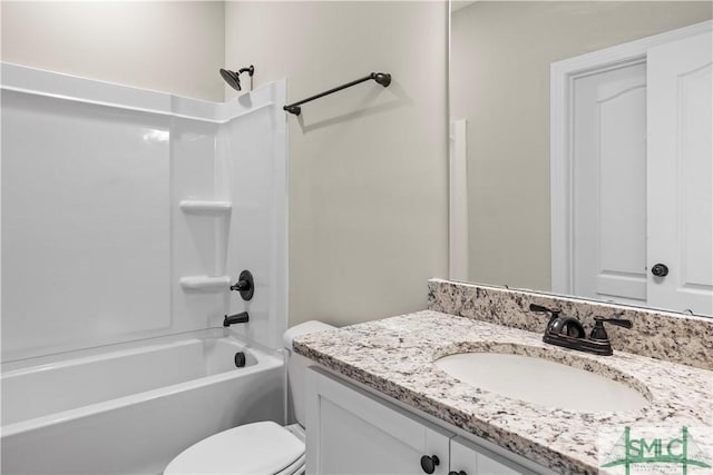 bathroom with shower / tub combination, toilet, and vanity