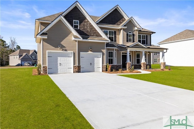 craftsman inspired home with a front yard, concrete driveway, a garage, and stone siding