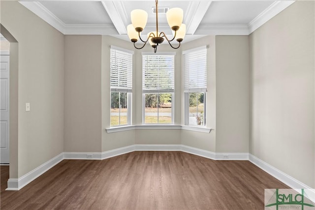 unfurnished dining area featuring visible vents, a healthy amount of sunlight, baseboards, and wood finished floors