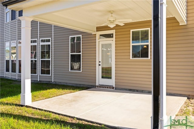 property entrance with ceiling fan and a patio area