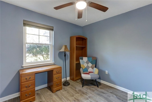 sitting room featuring ceiling fan and light wood-type flooring