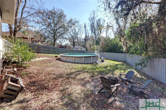 view of yard featuring a fenced in pool