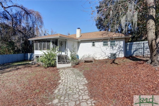 back of property featuring a sunroom