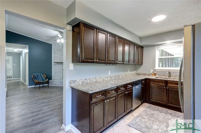 kitchen featuring dark brown cabinets, stainless steel appliances, and sink