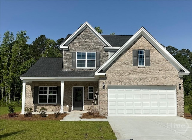 88 Split Branch Dr, Richmond Hill, GA 31324 - craftsman-style house with driveway, an attached garage, a front yard, and brick siding